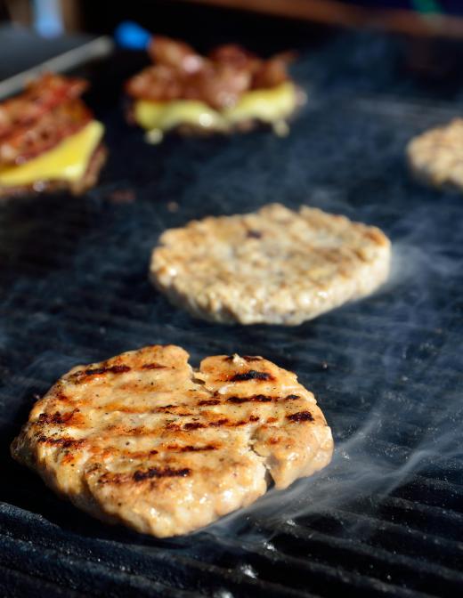 Grilling with wood can enhance the flavors of certain meats.