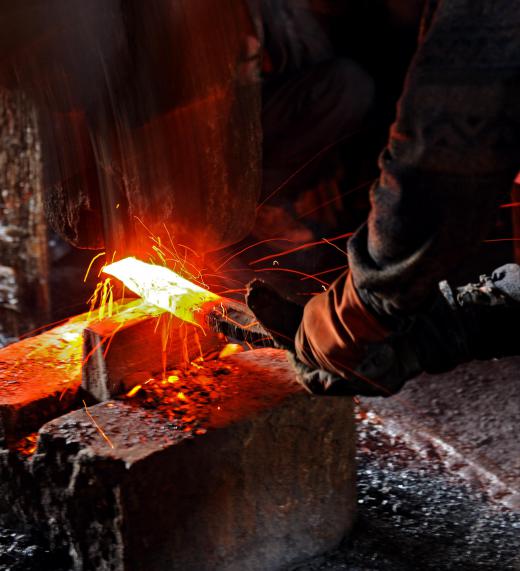 When a double hammer is used to shape a piece of metal it is known as smith forging because it is a technique used by blacksmiths of old.