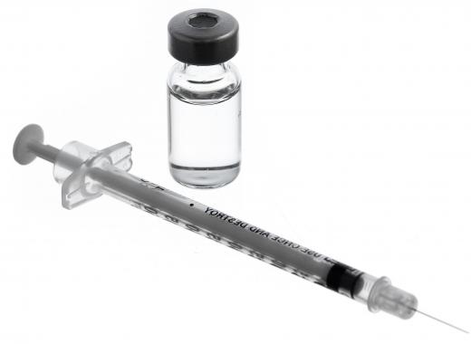 A syringe and container of morphine sulfate.