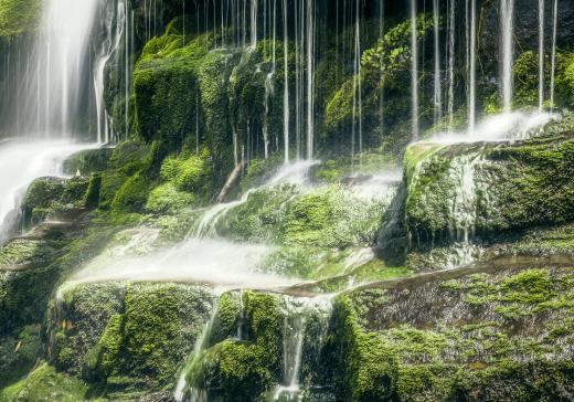 Someone may hike to a waterfall in order to perform water meditation.