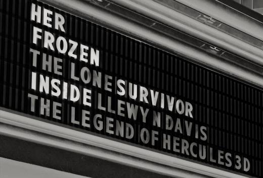 A theater marquee has changeable lettering so the movies of the day can be posted.