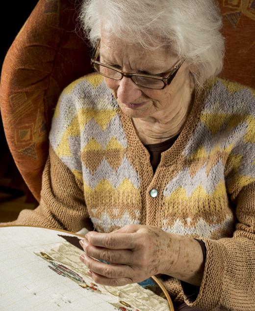 Adult day care may offer seniors creative activities to do, such as needlepoint.