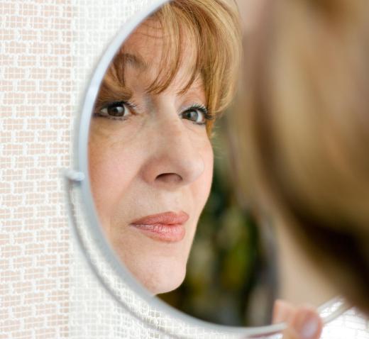 Round mirrors that hook into the wall may be suitable for use in a bathroom.