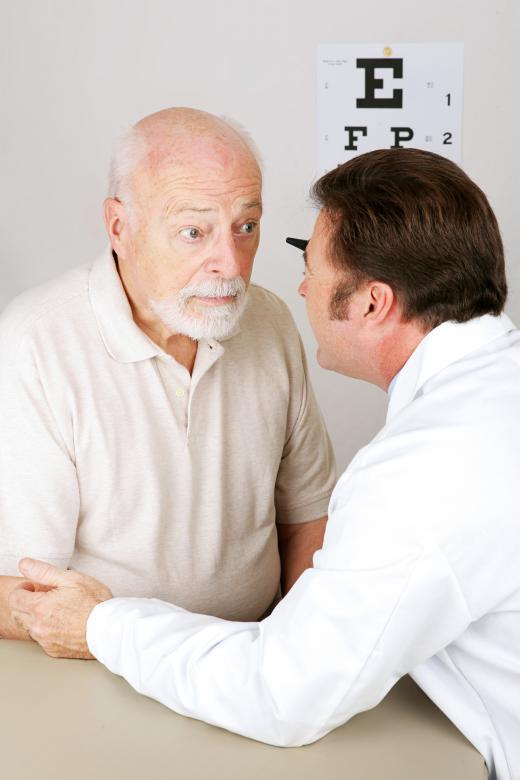 A hospital optometrist examines the eyes of patients who have been admitted to a hospital.