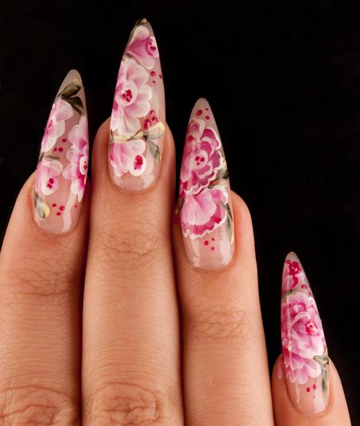 Artificial nails applied by an esthetician.