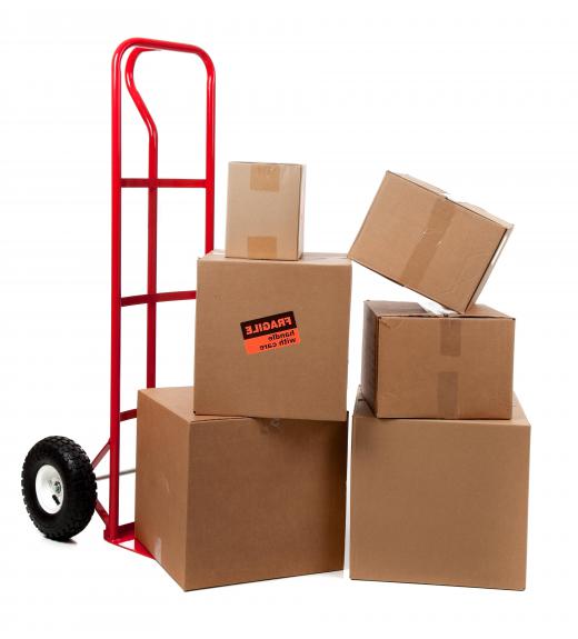 Many package handlers use moving dollies to help them load and unload trucks.