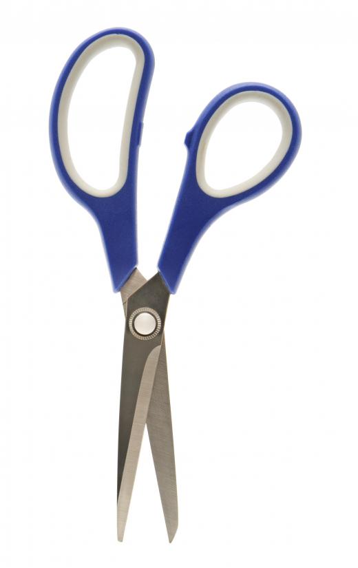 Regular scissors, pinking shears and various types of quilting cutters are used to cut several cloth squares at once.