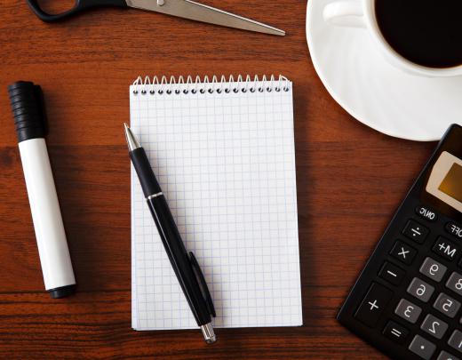 A home office executive desk should have enough tabletop space to accommodate office supplies.