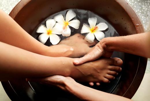 A woman using a pedicure tub.