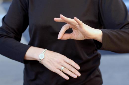 Simultaneous sign language interpreters translate spoken language into sign language for the deaf or hearing impaired, just moments after the information is presented.