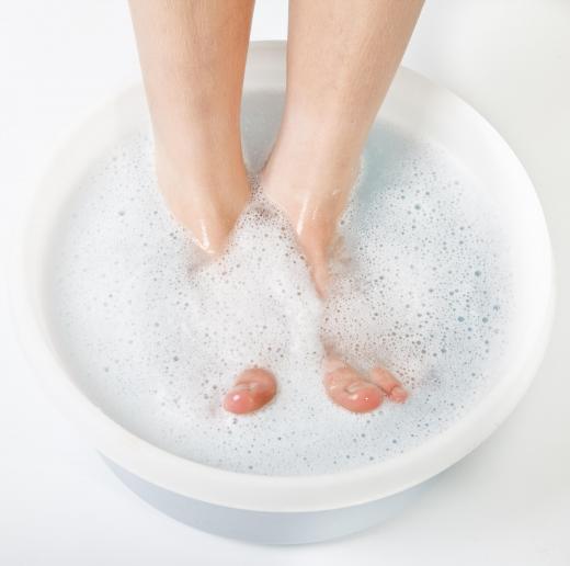 A doctor may have a patient soak their feet in hot water to induce symptoms of erythromelalgia.