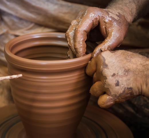 Some pottery wheels come with no accessories, while others have their own work tables attached.