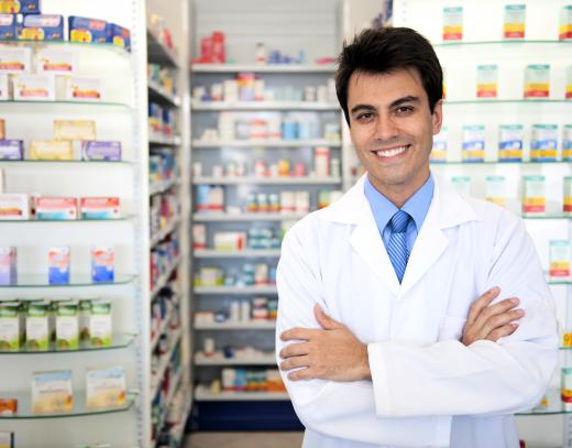 A pharmacist mixes and dispenses prescription drugs.