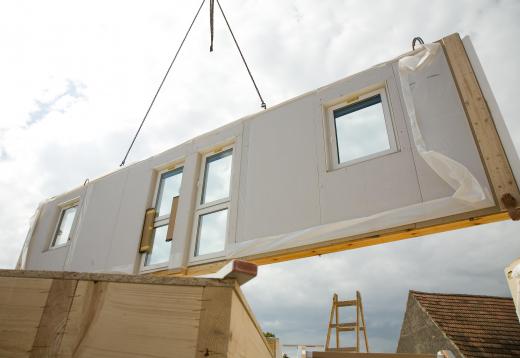 Most prefab homes are delivered in many large pieces.