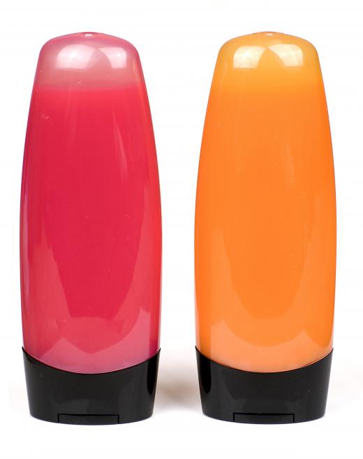 Bottles of pink and orange bath gels.