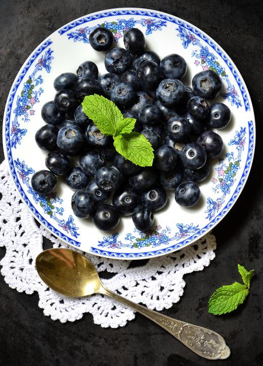 Blueberries are a good addition to millet porridge to help give it some flavor.