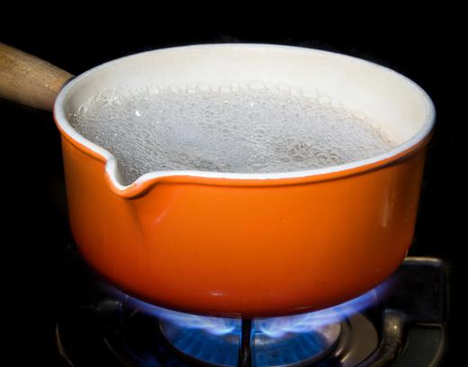 Blanched broccoli is prepared by briefly placing florets into boiling water.