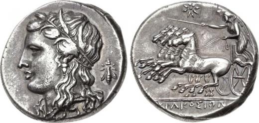 Rare Greek silver coins, a form of antique currency.