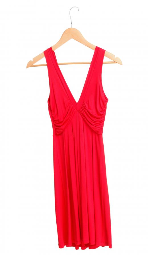 A cocktail dress with lightweight fabric works well for an evening wedding in the spring or summer.