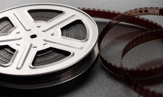 A film archivist may take original film rolls and copy and store them digitally.