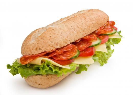 Sandwiches made with fresh luncheon meats, cheeses, lettuce, and tomato make for an easy summertime meal.