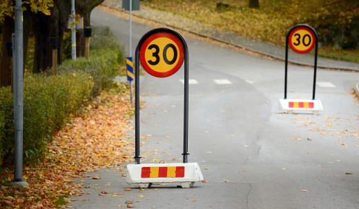 A written driving test may include questions on road signs.