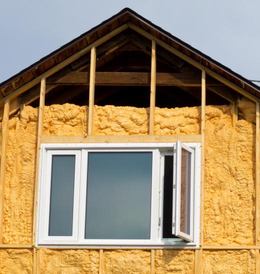 Spray-on foam insulation on a house.