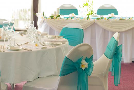 Vinyl tablecloths may be used for decorating a table for a wedding celebration.