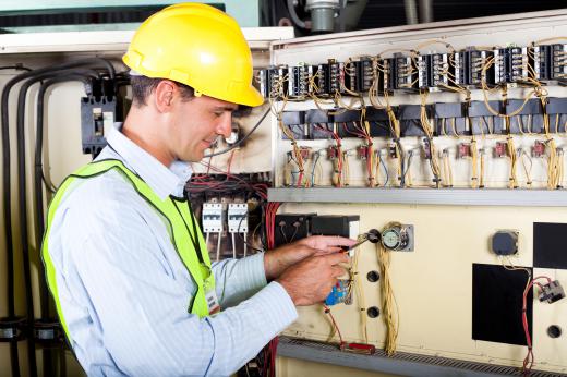 A maintenance electrician working.