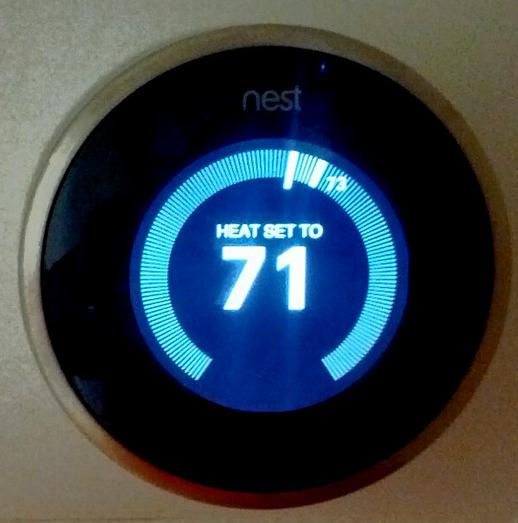 A programmable digital thermostat.