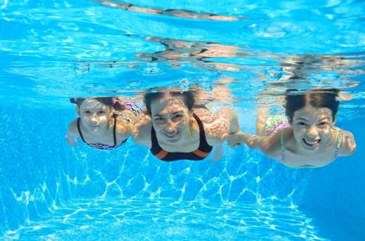 Most swimming pool kits include a filter and pump station that clean the water.