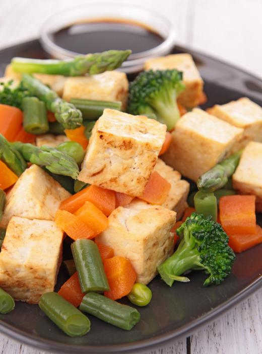 Tofu often replaces meat in a vegan stir-fry.