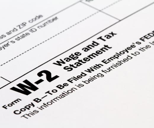 A W-2 form reports wages, taxes withheld, and Social Security and Medicare taxes.