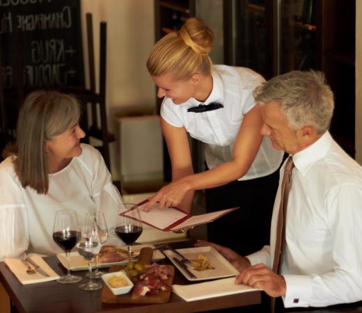 Waitresses sometimes earn less than minimum wage, with the expectation that they will make up the difference in tips.