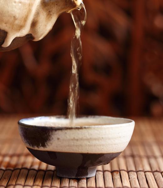 The first step in cleaning pennies is filling a shallow bowl about half full with water.