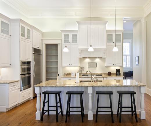 Refinishing cabinets is an inexpensive way to remodel a kitchen.