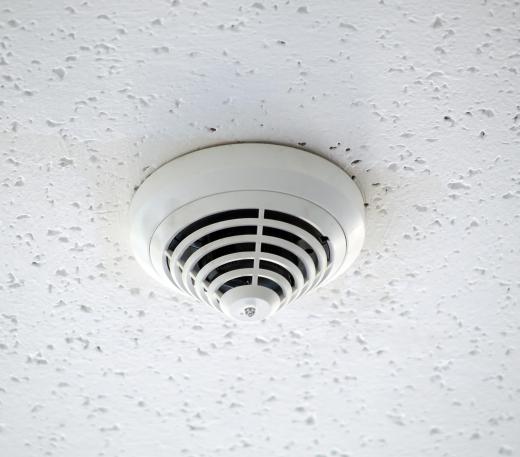 A smoke detector will alert people of smoke, and thus fire, long before they would otherwise sense it.