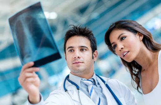 A radiographer provides X-rays to a radiologist.