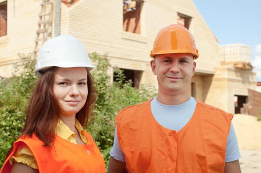 A construction apprentice gains experience on the job under the guidance of an experienced worker.