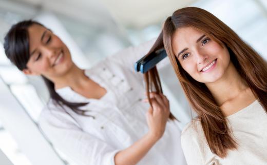 Straightening irons help to tame long, frizzy hair.