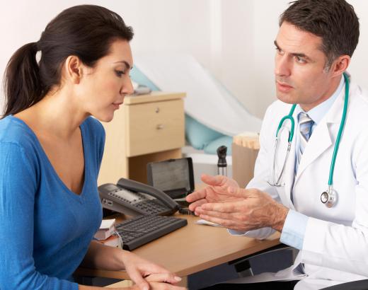 A medical auditor reviews medical records, which contain information about a patient's health and medical treatment history.