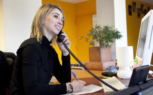 A corporate receptionist handles front office duties.