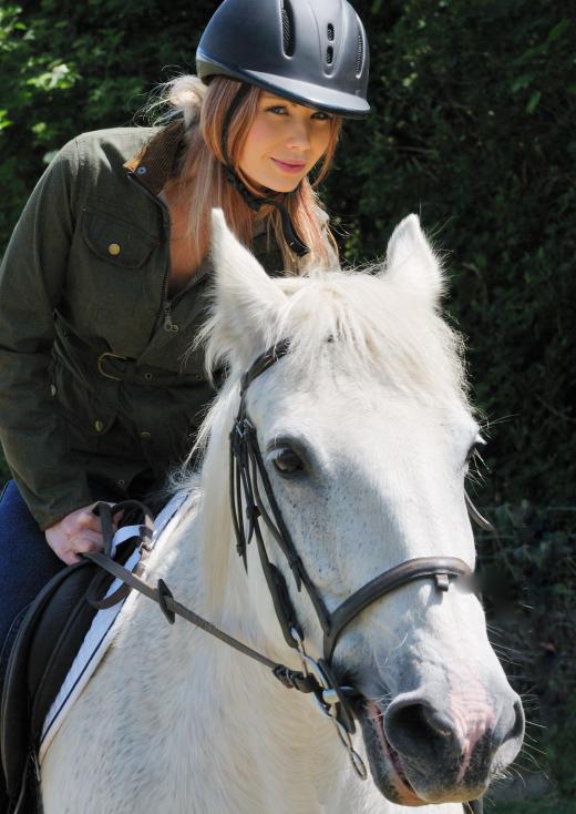 Therapeutic horseback riding helps improve muscle tone and balance.