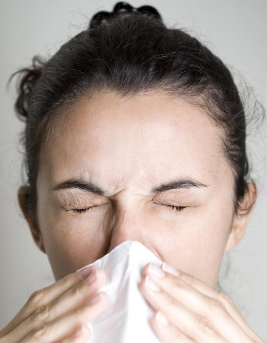 An allergic reaction may cause an itchy nose and sneezing.