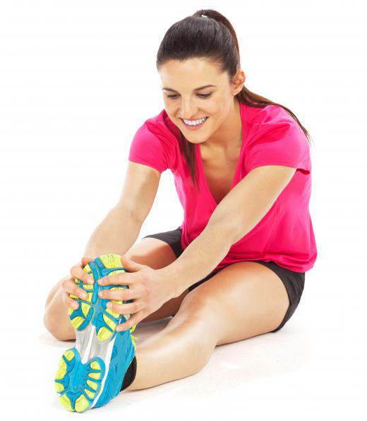 Static stretching is when a person positions her body in a stretch and then holds it for a time.