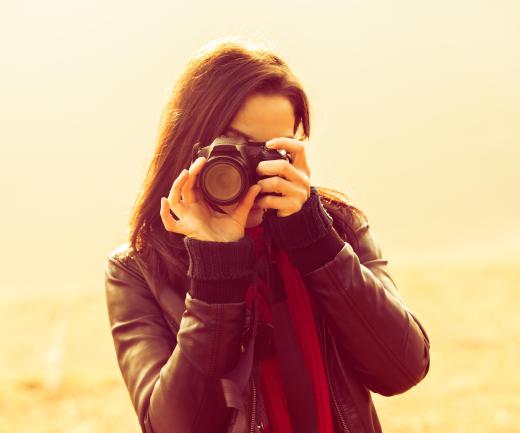 A studio photographer may work independently.