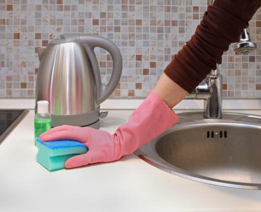 Disinfecting spray can help prevent the spread of germs on kitchen surfaces.