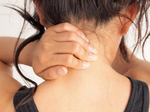 A woman with a muscle knot in her neck.