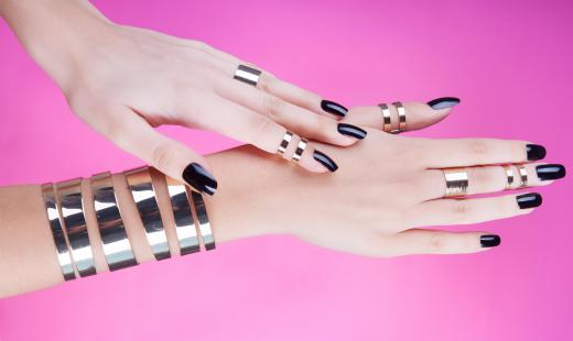 Womans Hands With Black Nail Polish 