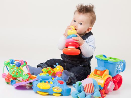 A teething baby is in the process of growing deciduous teeth.